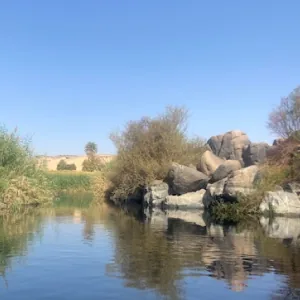 Granite rocks reflected in calm water